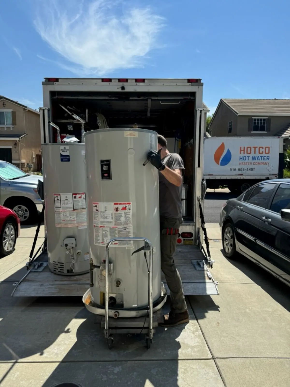 Commercial water heaters loaded on a HOTCO truck for a property management installation - Property Management