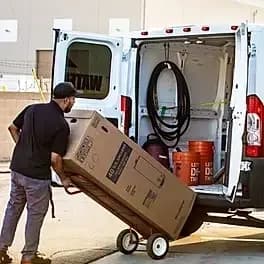 HOTCO Hot Water Heater Company branded delivery van - What's Included in a HOTCO Water Heater Installation: Free Delivery, Haul-Away and More