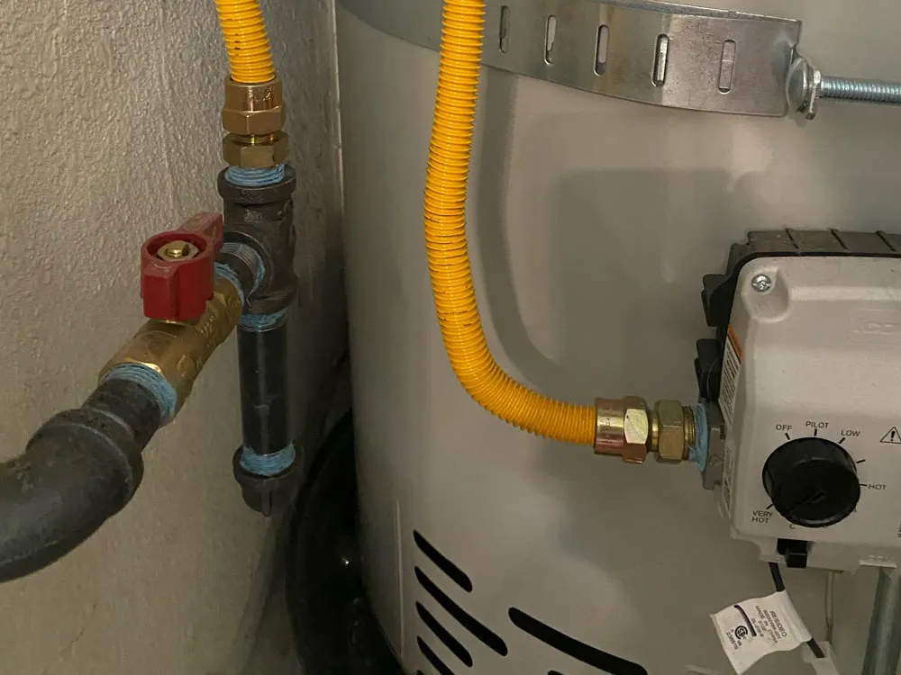 Code-compliant gas line with sediment trap drip leg and shut-off valve on a water heater - Gas Drip Leg & Shut-Off